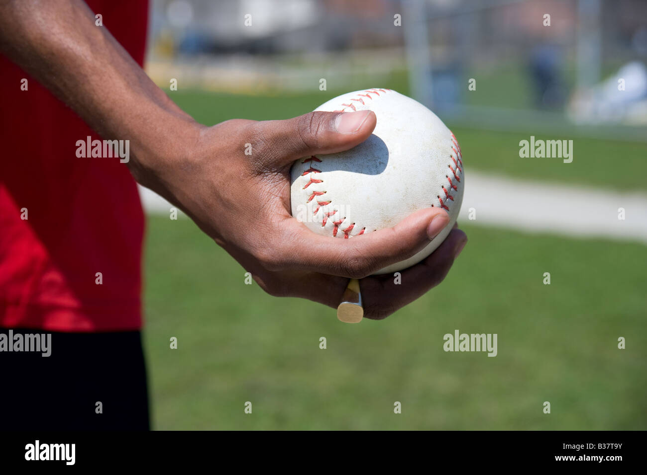 Hand holding a softball Stock Photo Alamy