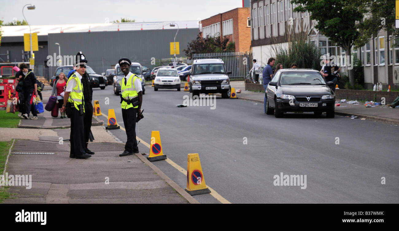 Traffic wardens on duty on Tessa Road during the Reading Festival, Reading, UK Stock Photo