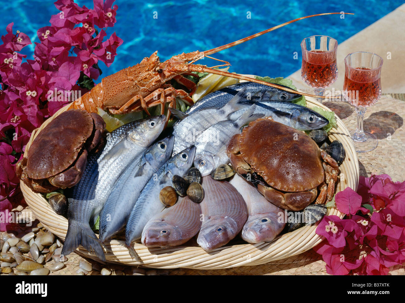 Seafood, Fish, shellfish, seafood  & crayfish by a swimming pool Stock Photo