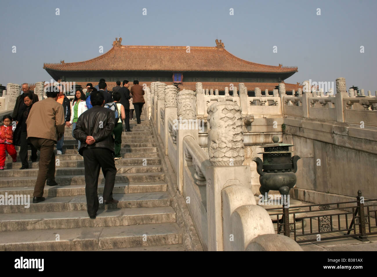 Tourists climb the stairs towards the Hall of Supreme Harmony, The Forbidden City, Beijing, China Stock Photo