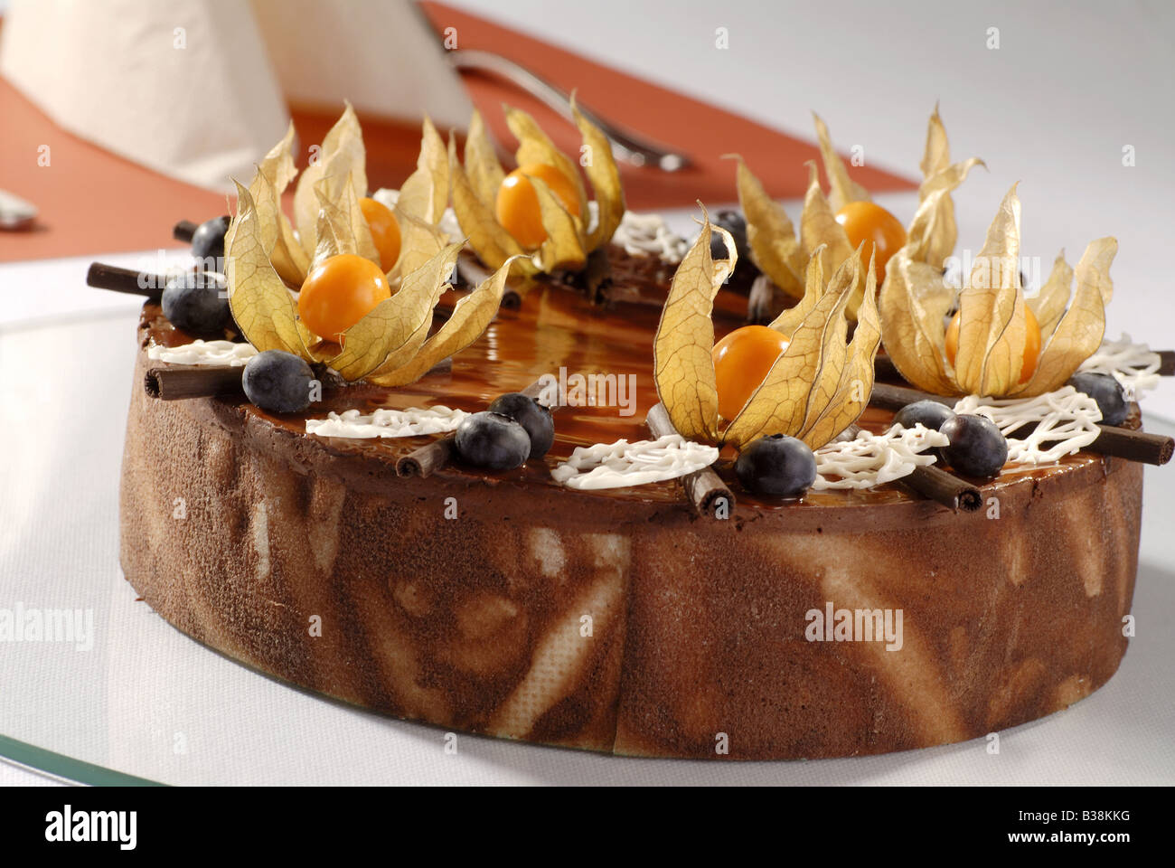 Chocolate Cream Cake Topped with Physalis Stock Photo