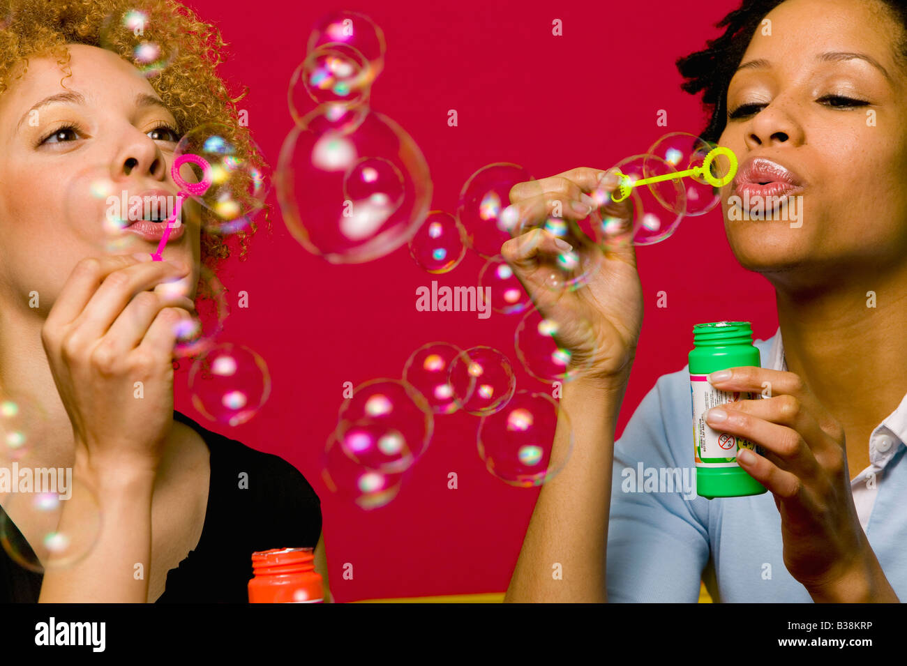African women blowing bubbles Stock Photo Alamy