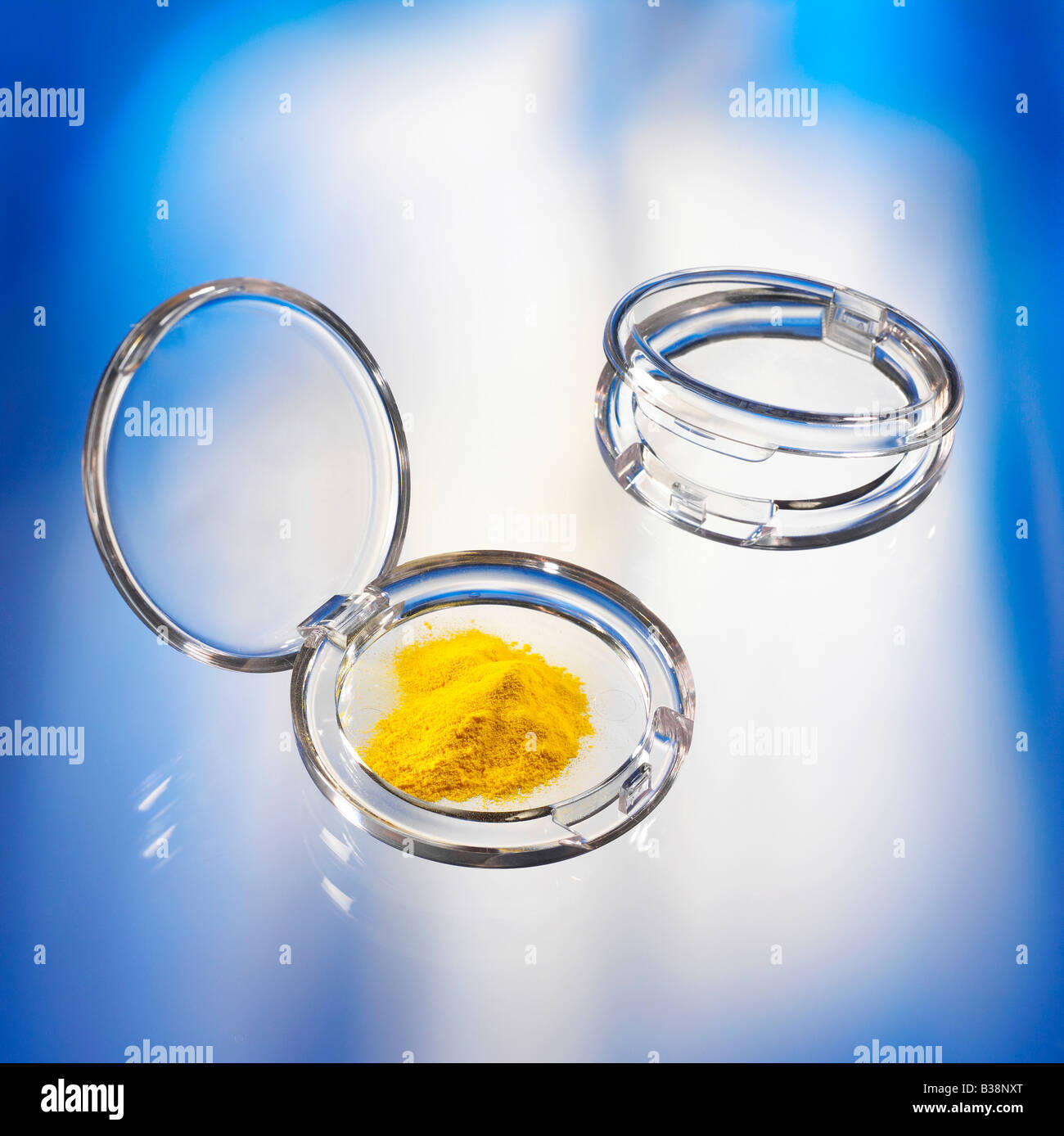 case using for decorative cosmetics with loose yellow maquillage Stock Photo
