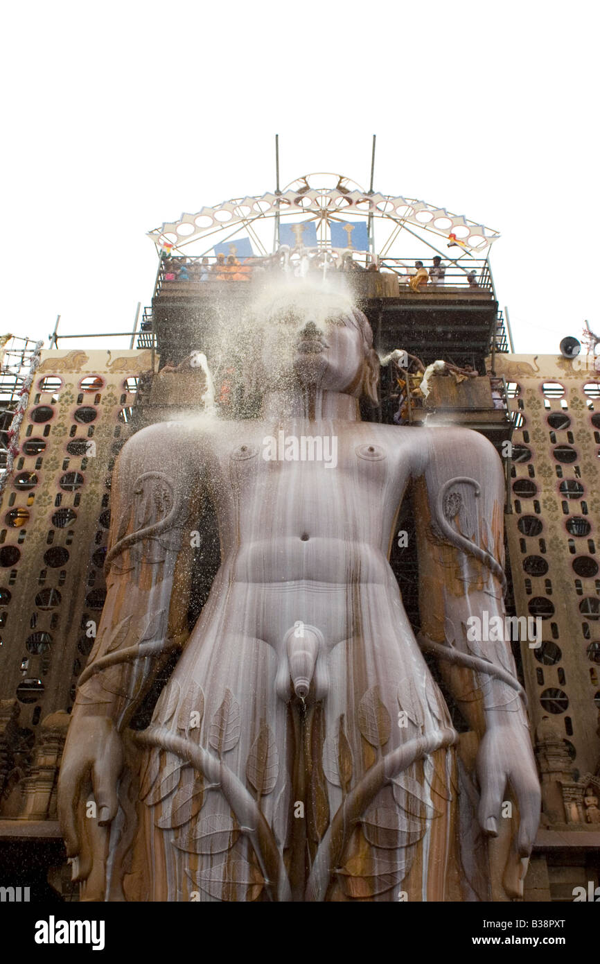 Pilgrims anoint the statue of Lord Bahubali during the Mahamastakabisheka festival in Shravanabelagola, Karnataka, India. Stock Photo