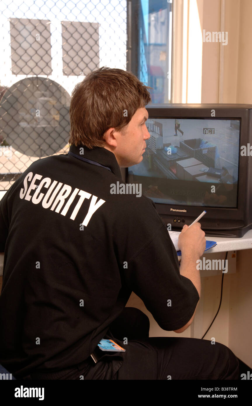 A SECURITY GUARD CHECKS CCTV IMAGES AT A CHECKPOINT UK Stock Photo Alamy
