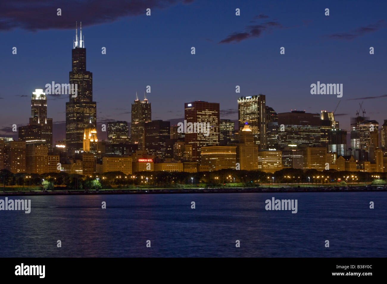 Chicago Illinois Skyline at Evening.   Sears Tower (Willis Tower) on Left, Lake Michigan in Foreground. Stock Photo
