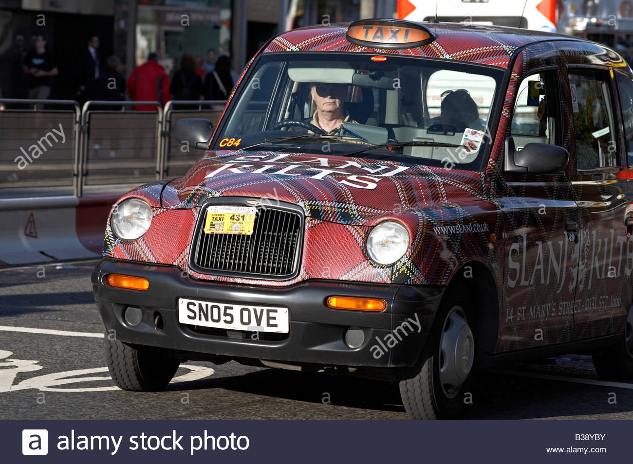 Edinburgh taxi with tartan advertising paintwork Scotland Stock Photo