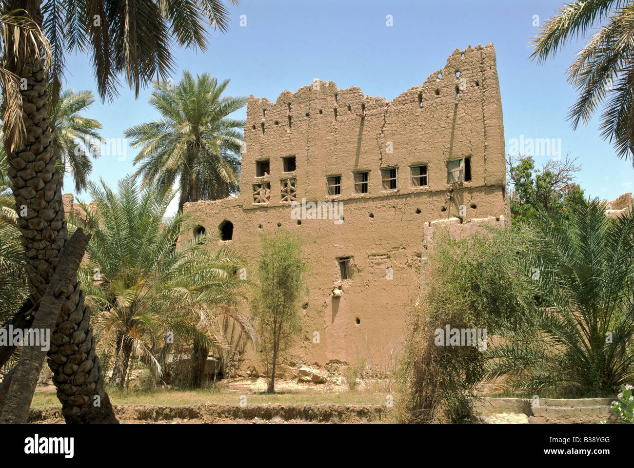 Typical two storied clay and wood house in decay Al Hamra Al Dakhiliyah Region Sultanate of Oman Stock Photo