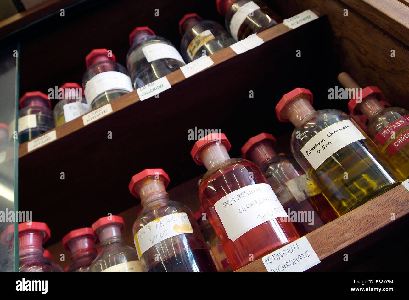 Chemical storage bottles on shelf in a college laboratory Stock Photo Alamy