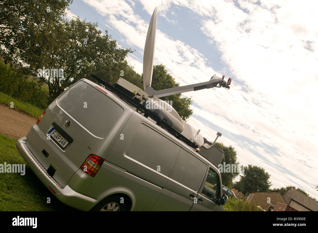An uplink satellite dish mounted on roof of a vehicle used for fast response news coverage Stock