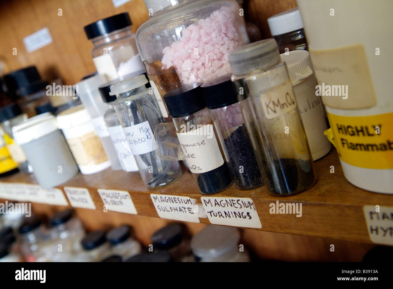 Chemical storage bottles of magnesium on shelf in a college laboratory