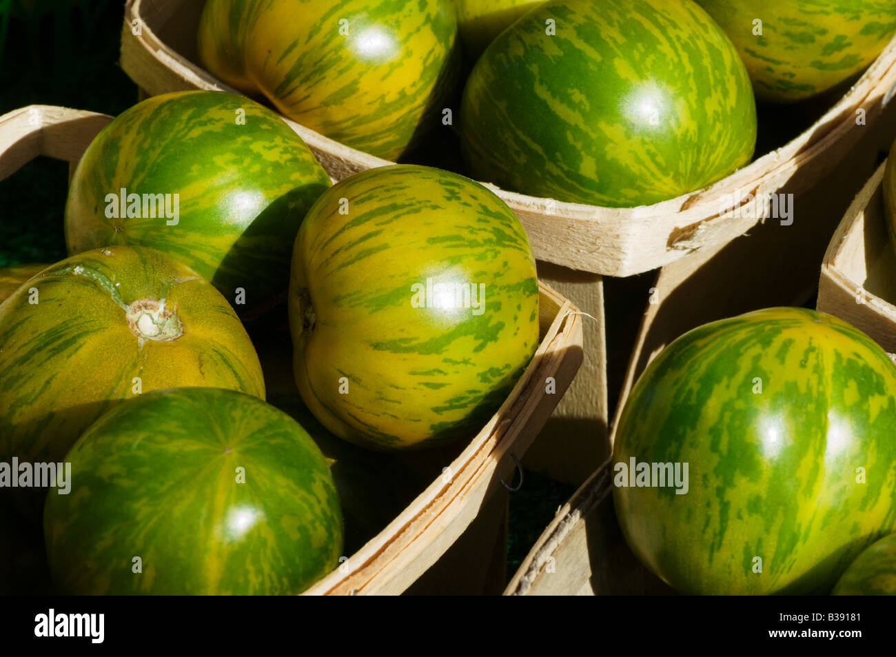 Green tomatoes on sale at a Chicago farmers market Stock Photo - Alamy