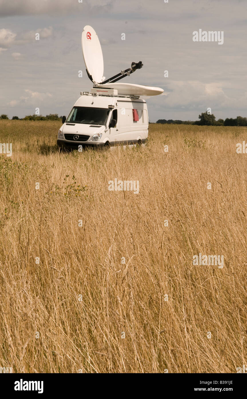 satellite up link vehicle on location in a remote location Stock Photo