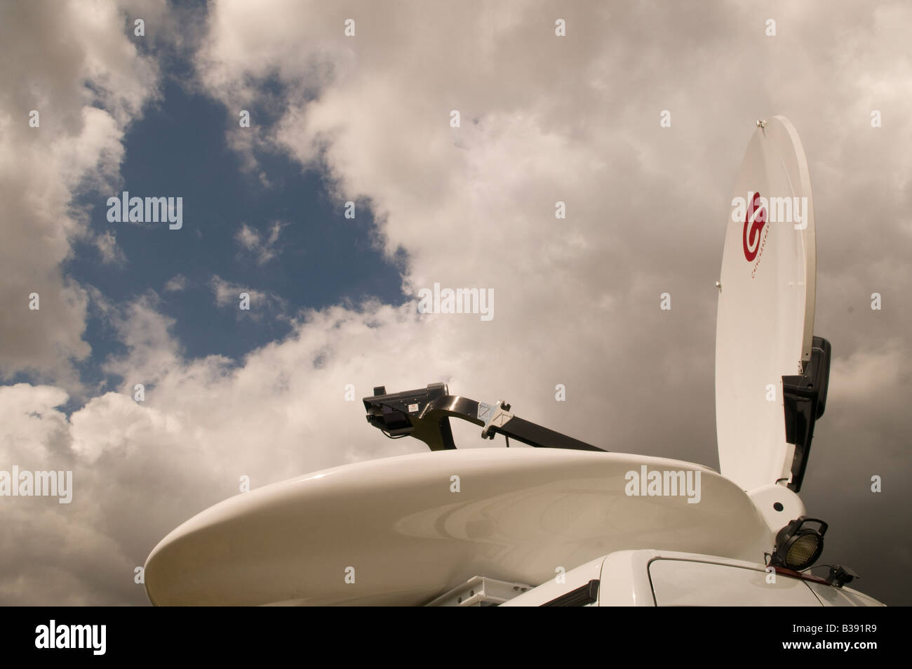 satellite uplink dish on the roof of a  van Stock Photo