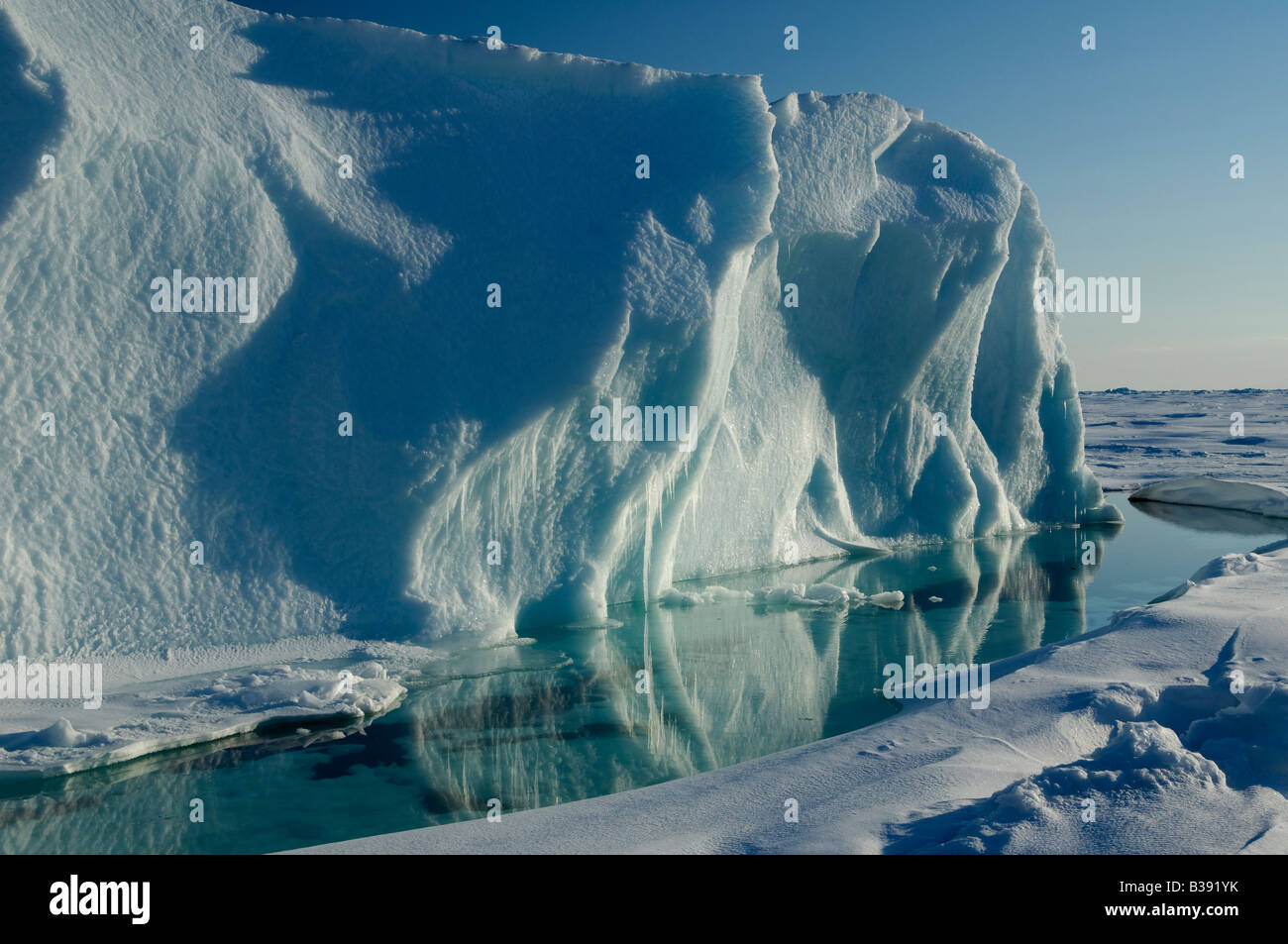 An Iceberg on Cobourg Island in the Canadian Arctic melting in the sunlight. Stock Photo