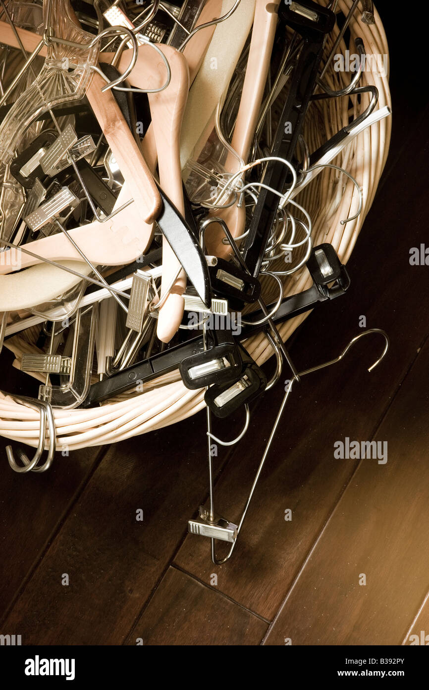 Basket of clothes hangers Stock Photo Alamy