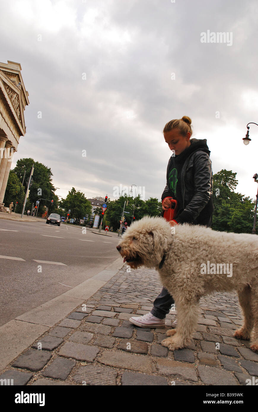 Young girl walking with her Dog Stock Photo - Alamy