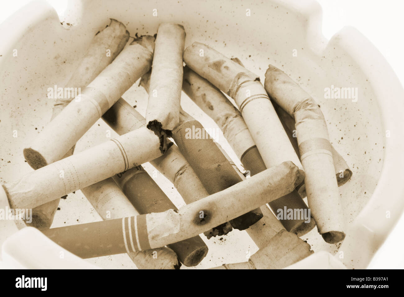 Cigarette Butts on Ash Tray Stock Photo
