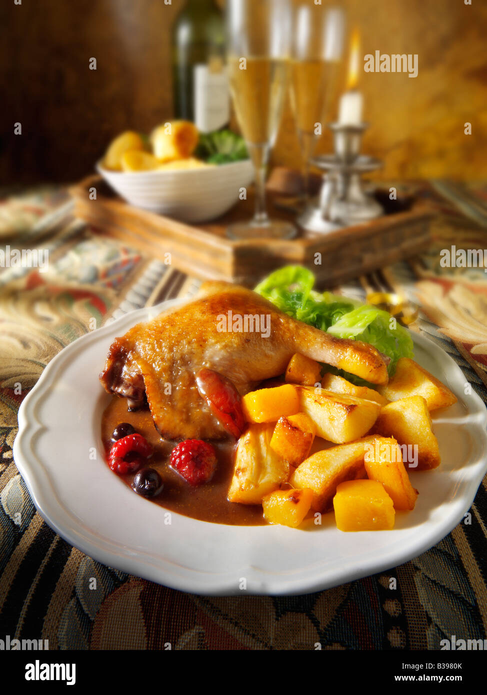 Roast Gresham duck leg served with winter fruit sauce, roast potatoes