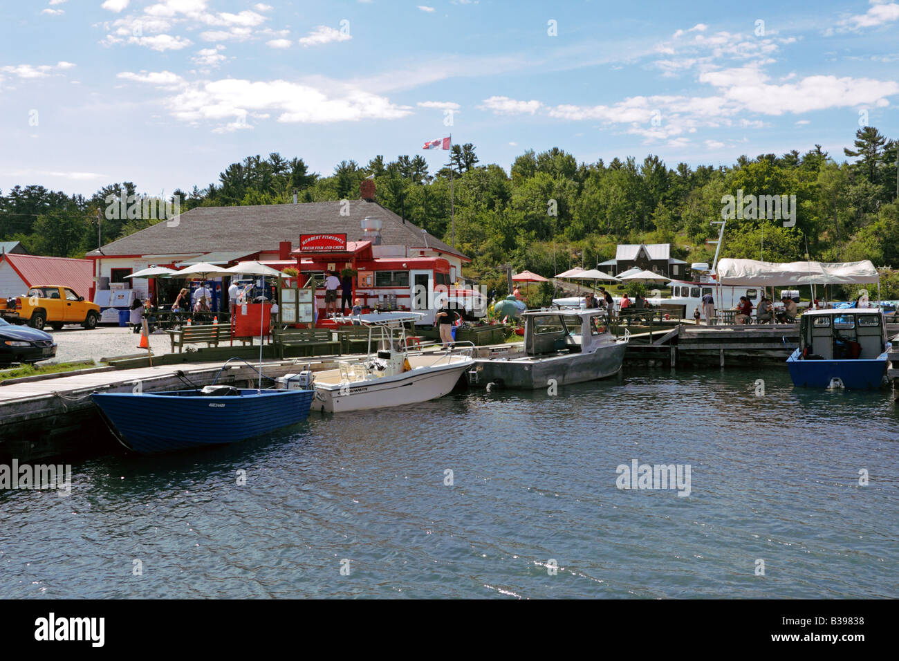 Busy Channel Street with tourists in fish and chip eatery and docking