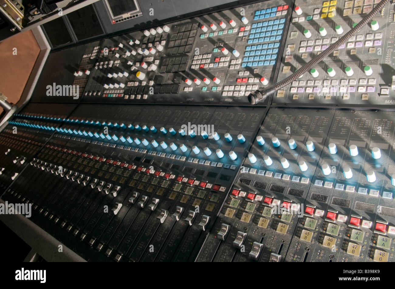 calrec audio mixing console showing the faders Stock Photo