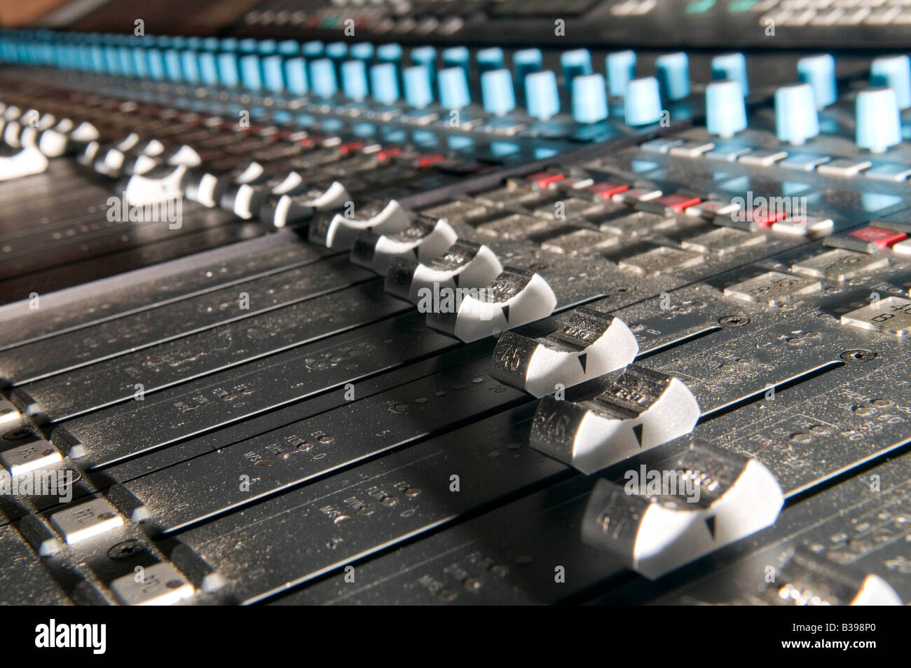 calrec audio mixing console showing the faders Stock Photo