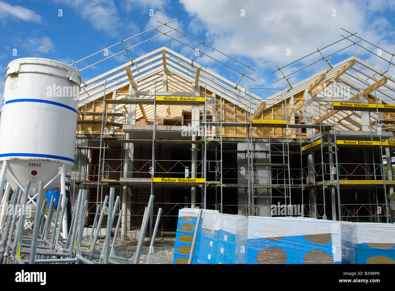 House construcion site with insulating material in front Stock Photo