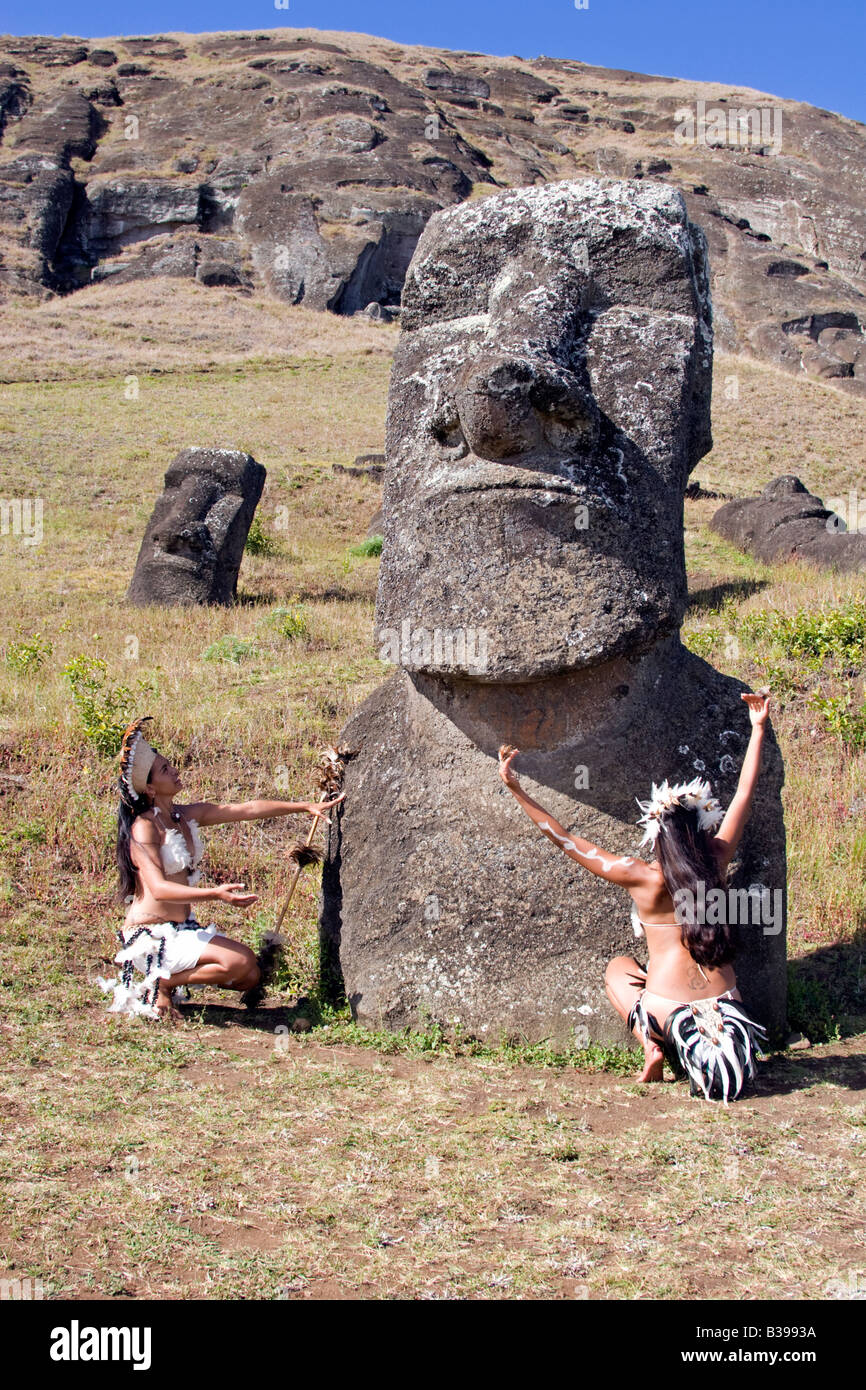Rapa Nui dancers in traditional costume at ancient giant stone head in ...