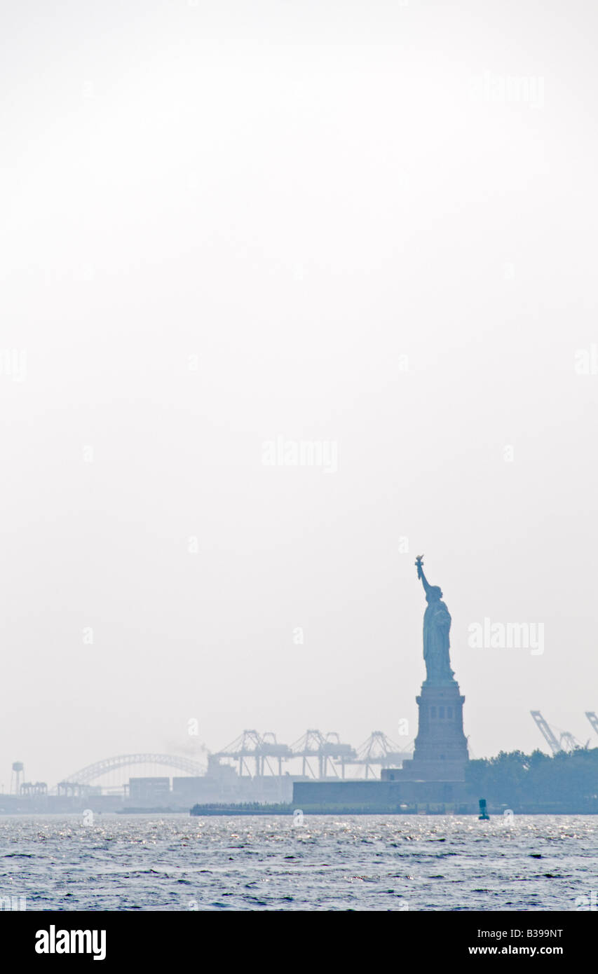 Statue of Liberty in the haze, looking from Battery Park on Manhattan