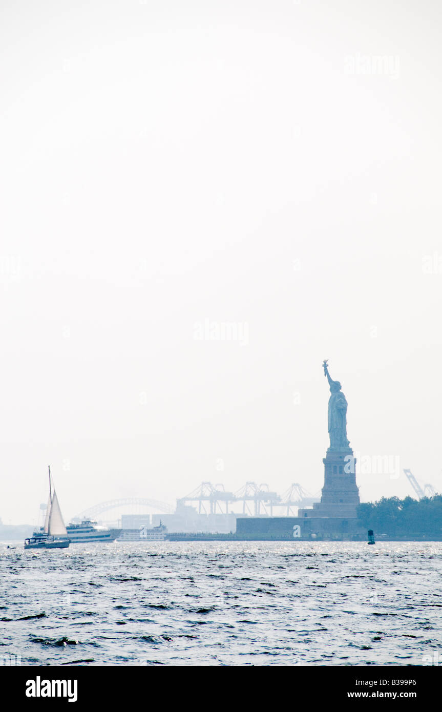 Statue of Liberty in the haze, looking from Battery Park on Manhattan