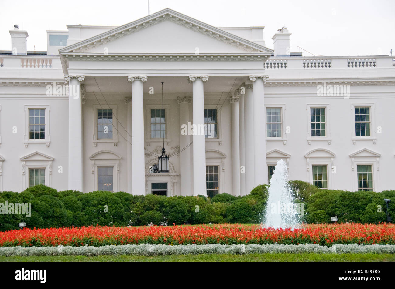 WASHINGTON, D.C., United States — The White House, the official residence and workplace of the President of the United States, stands prominently at 1600 Pennsylvania Avenue NW. This iconic neoclassical building has been the home of every U.S. president since John Adams in 1800. It is a symbol of the American presidency and a major landmark in the nation's capital. Stock Photo