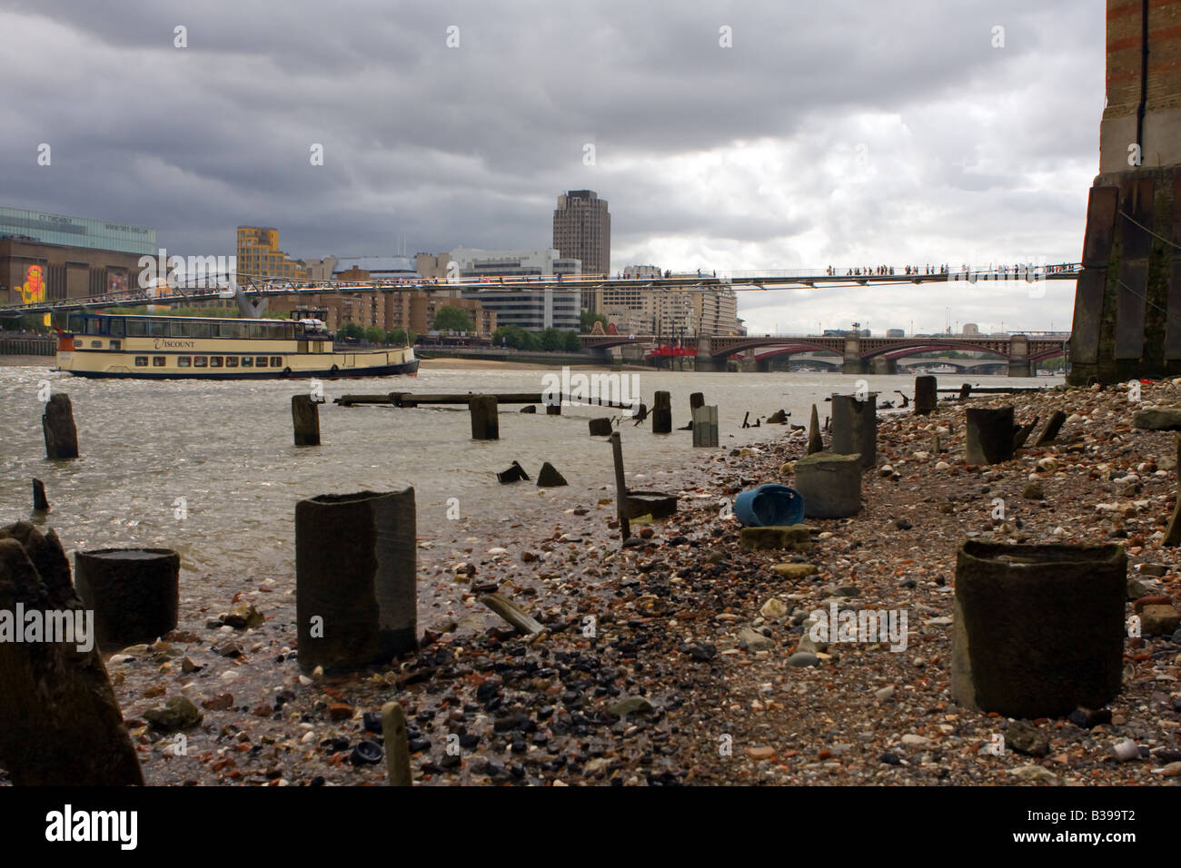 The shoreline of The Thames looking out towards the Millennium bridge Stock Photo