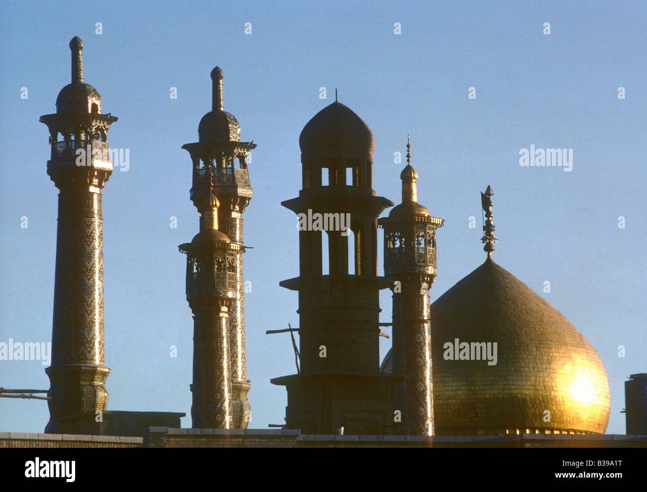 minarets and gilded dome at shrine of Fatima, Qom, Iran Stock Photo