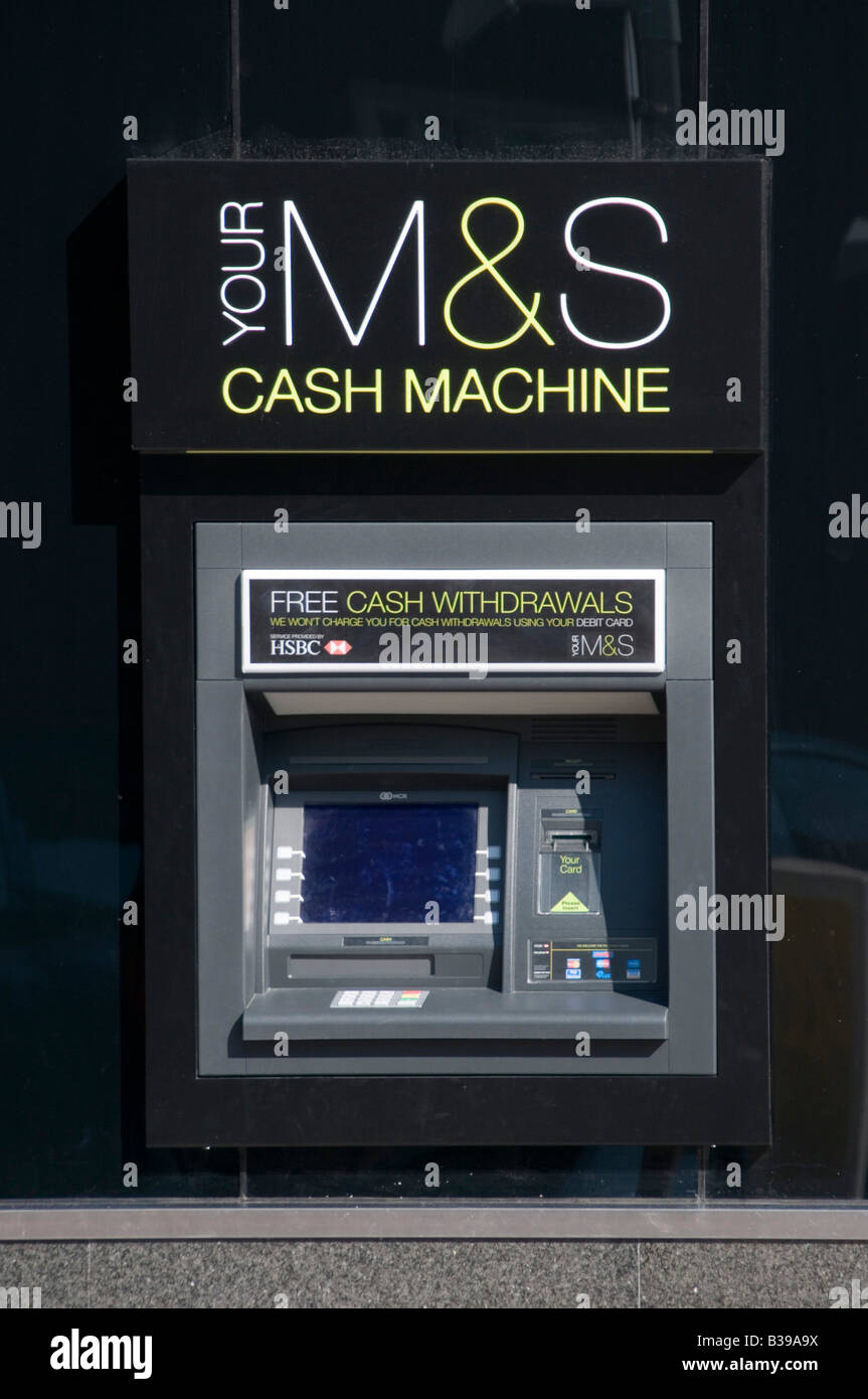Marks and spencer money ATM cash machine on exterior wall of store Stock Photo