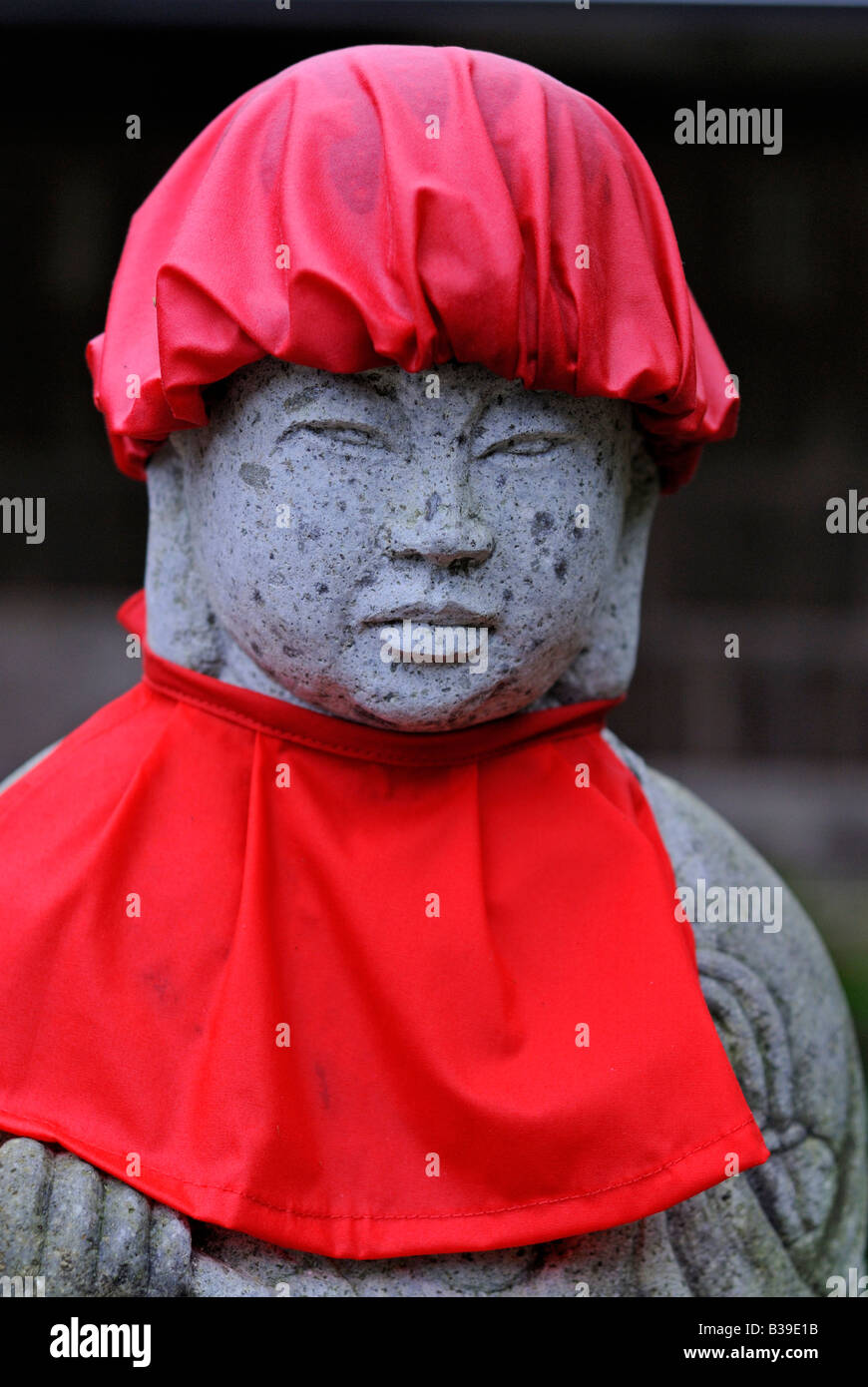 Detail of Jizo Bodhisattva statue with red bib and hat Tenri in temple Matsushima Japan Stock