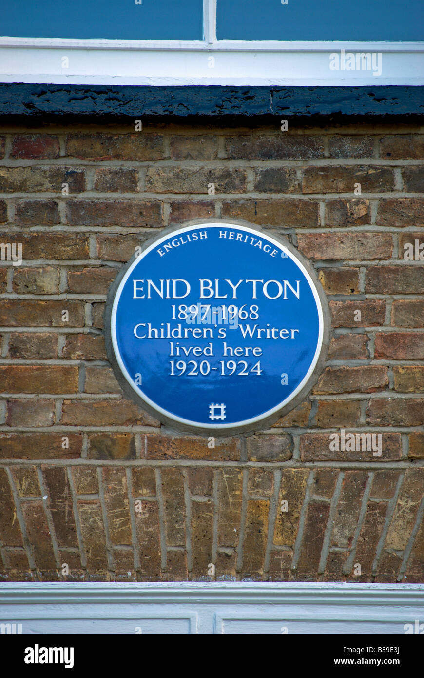 blue plaque marking a former home of enid blyton, popular author of stories for children, located in tolworth, surrey, england Stock Photo