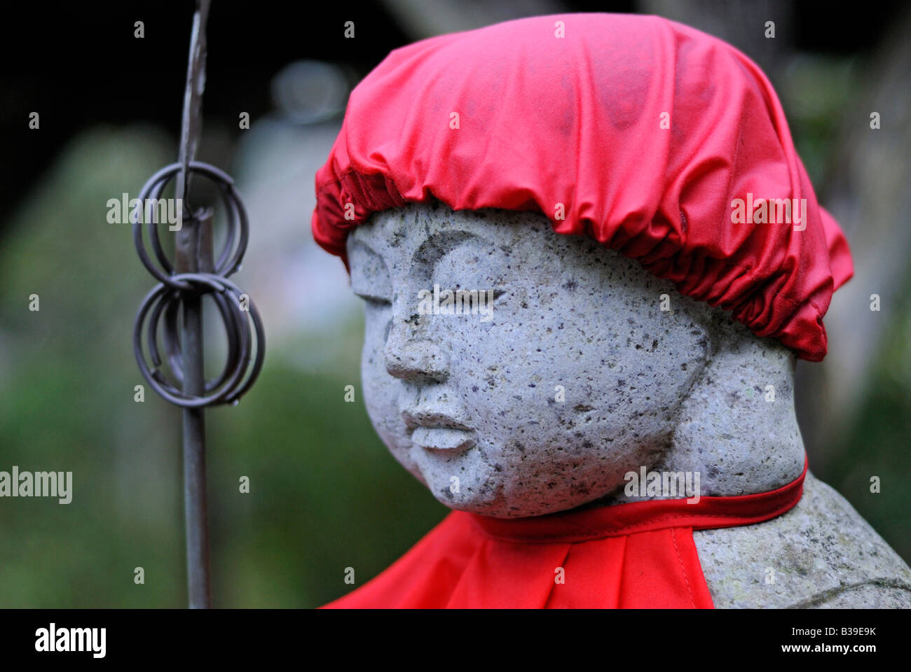 Detail of Jizo Bodhisattva statue with red bib and hat Tenri in temple Matsushima Japan Stock
