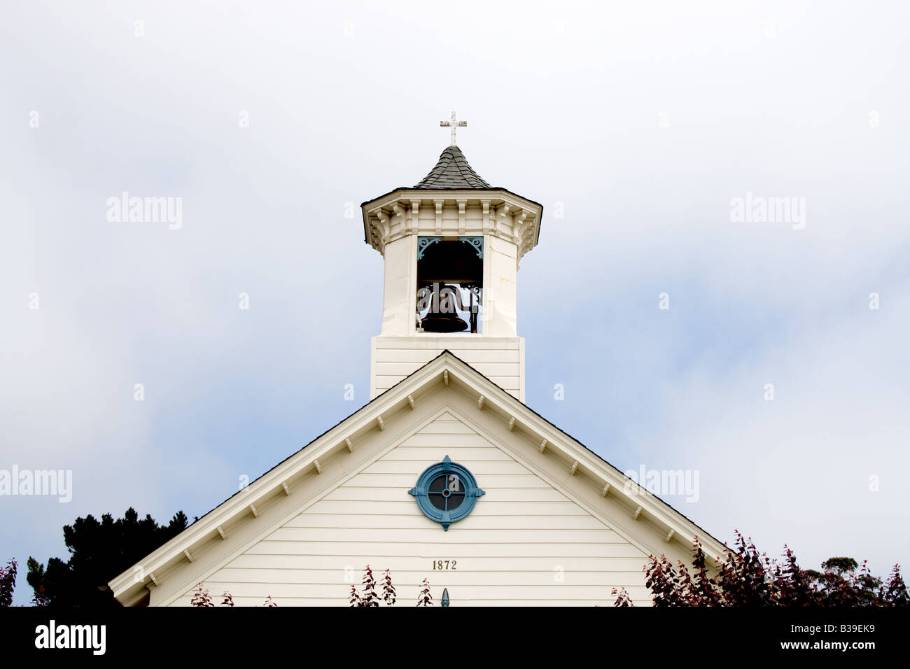 Small church tower with bell. Stock Photo