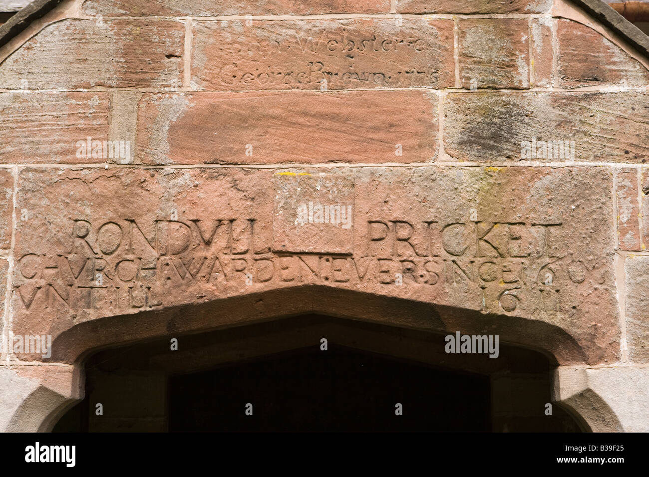 UK Cheshire Harthill All Saints Church 17th century names inscribed above door Stock Photo