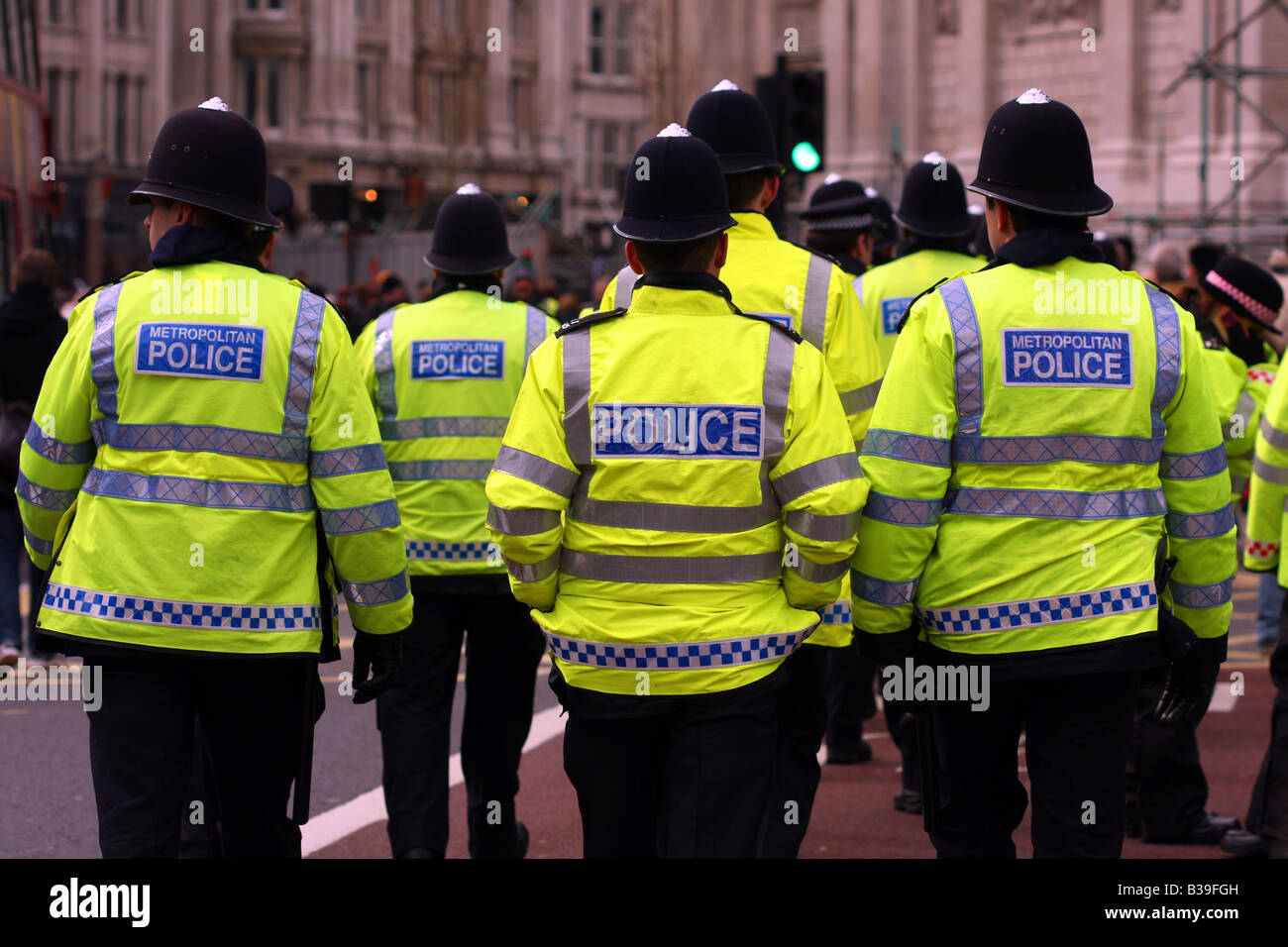 Policemen walking away outside St Paul's Cathedral Stock Photo