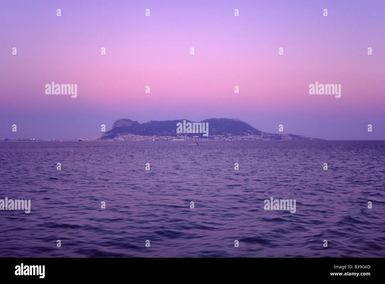 The Rock of Gibraltar view from ferry crossing the Straits to Africa at dusk Stock Photo