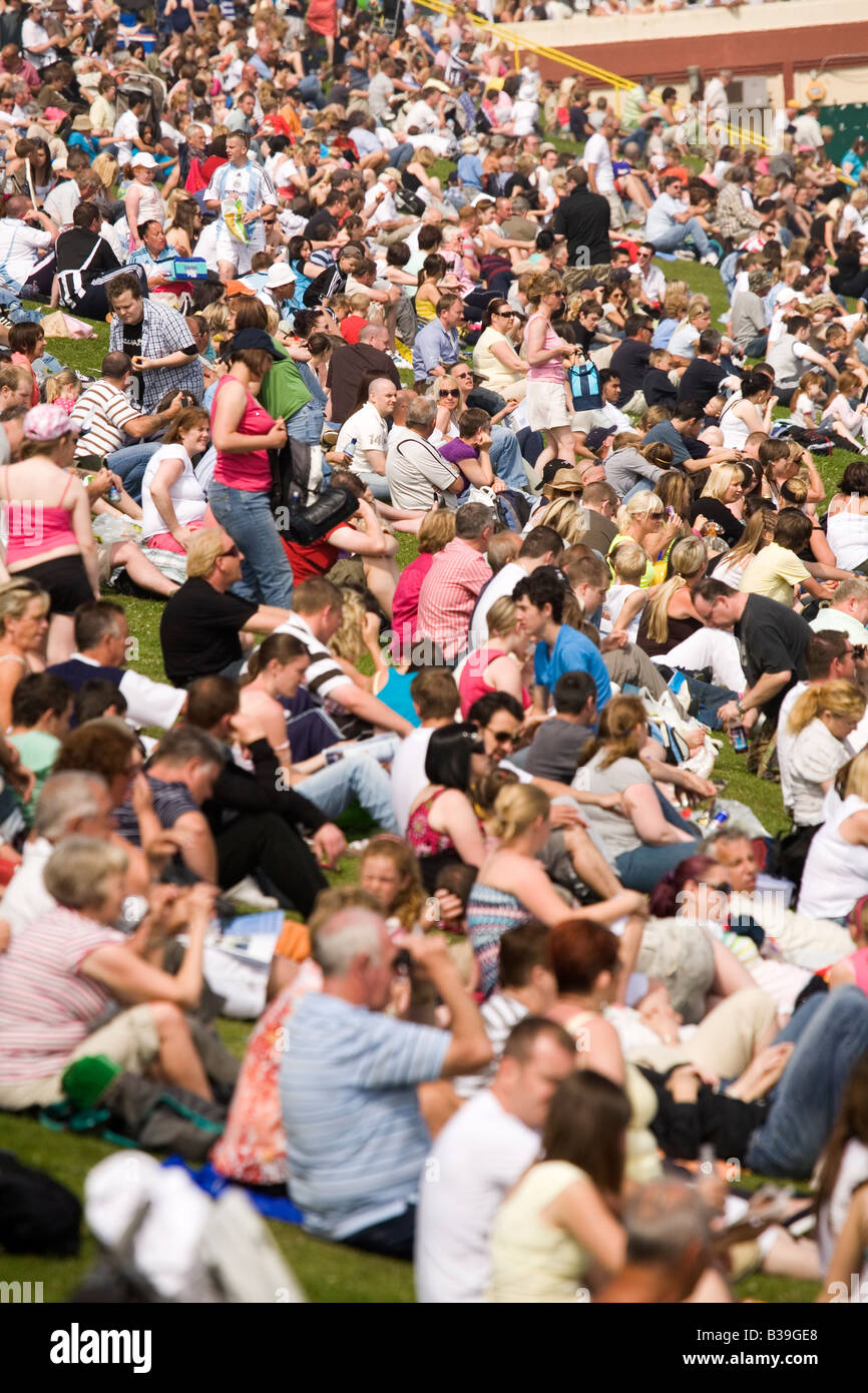 People sit by the promenade at Seaburn Beach during the Sunderland International Airshow of 2008. Stock Photo