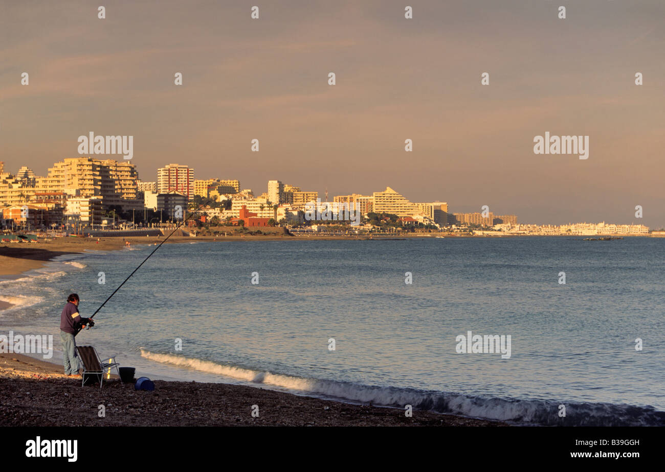 Angler on beach at Torremolinos Costa del Sol Andalusia Spain Stock Photo