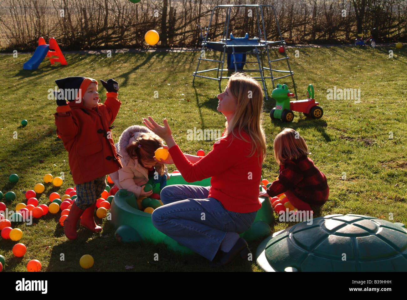 Children playing in a garden Stock Photo - Alamy