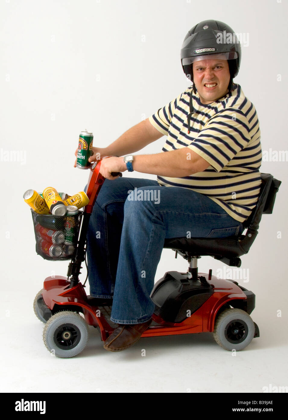 Disabled man in motorised wheelchair with cans of lager Stock Photo Alamy