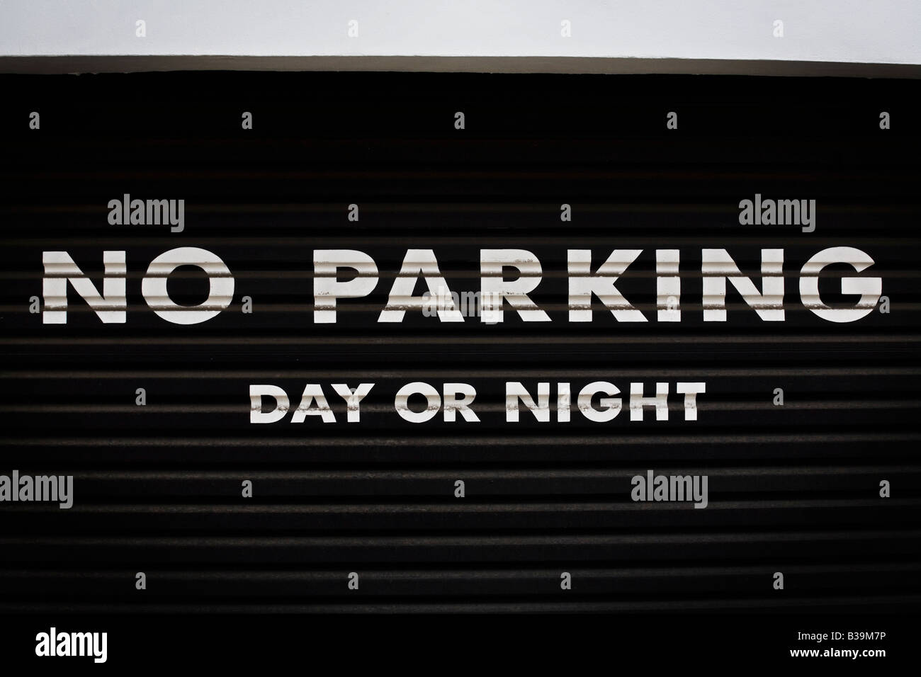 No parking sign in front of a garage in Onslow Square Kensington and Chelsea exclusive area of London SW7 UK Stock Photo
