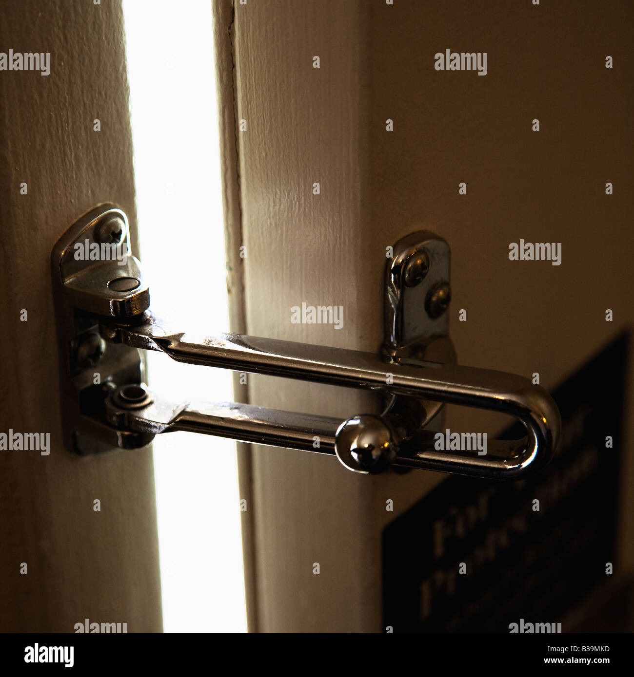 Close up of security lock on motel or hotel room door Stock Photo