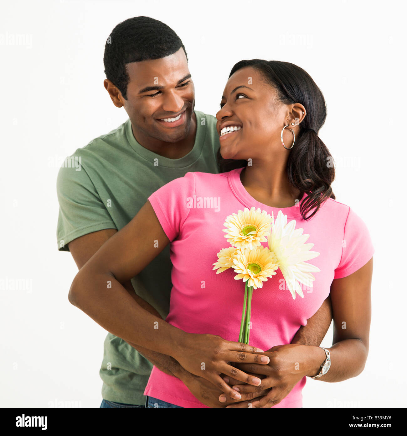 Portrait of smiling African American couple standing looking at each other Stock Photo