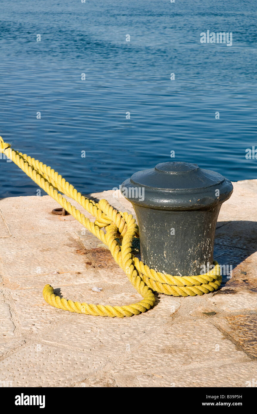 a bollard with rope on the dock Stock Photo