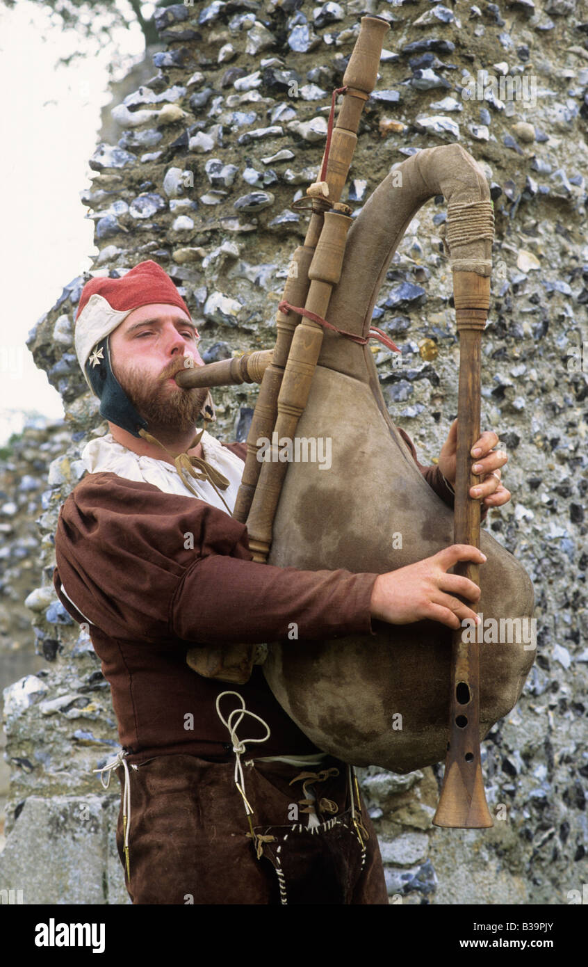 Medieval historical re enactment Musician playing blowing bagpipes